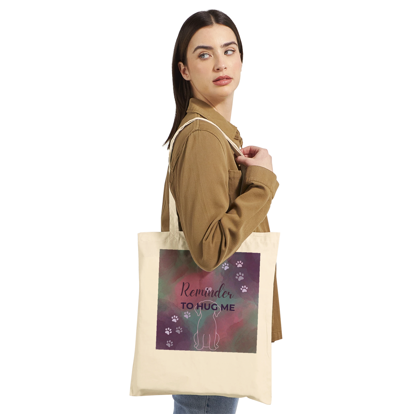 Woman holding a tote bag with a cat design and text on a white background
